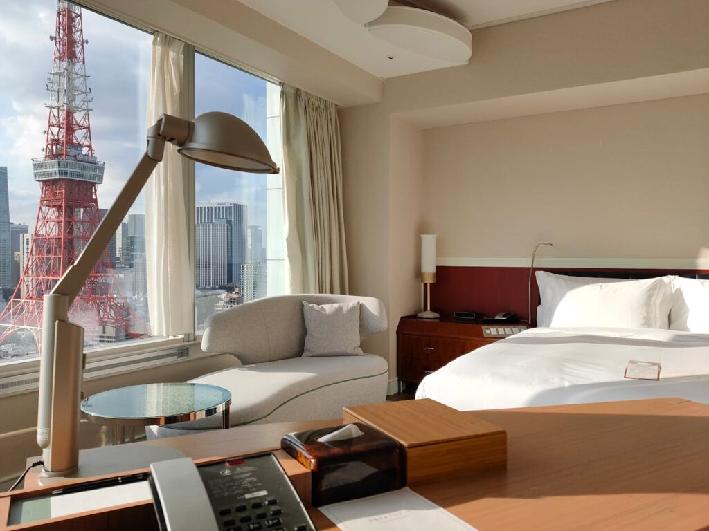 Elegant hotel room in Minato City, Tokyo with a stunning view of the iconic Tokyo Tower.